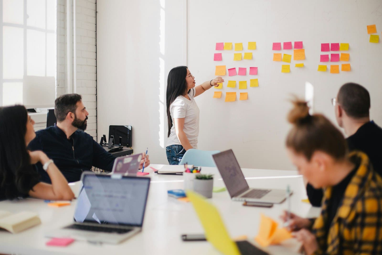 The Stackrunner team planning a project at a whiteboard